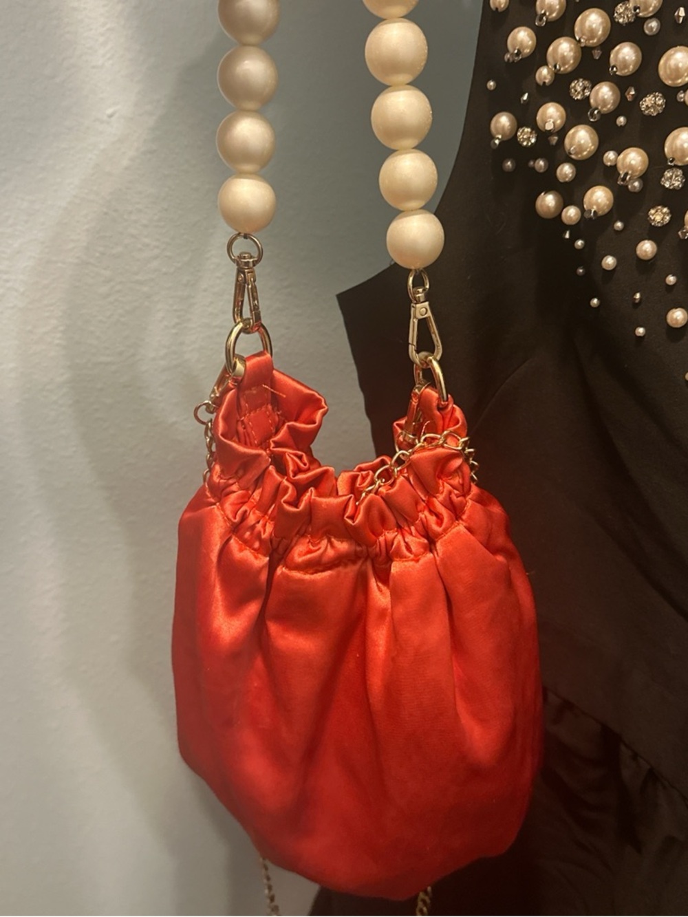 Anthropologie Satin Mini Drawstring Bag in Coral Orange with Pearl Handle